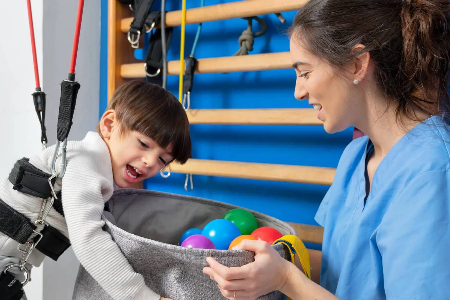 Therapist engaging in a Physical Therapy session with a child.